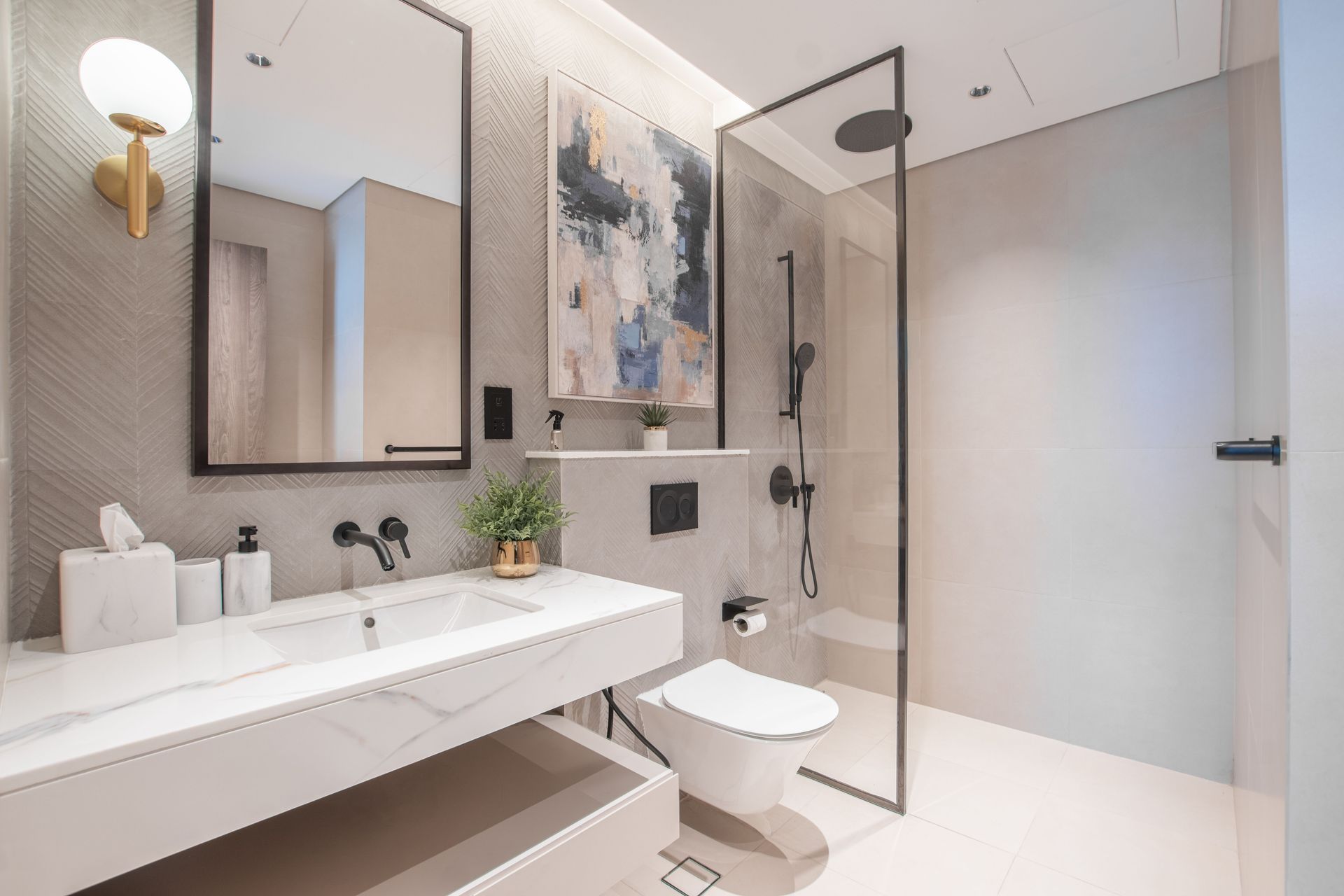 Elegant modern bathroom with minimalist design, featuring a shower, sink, and stylish decor.